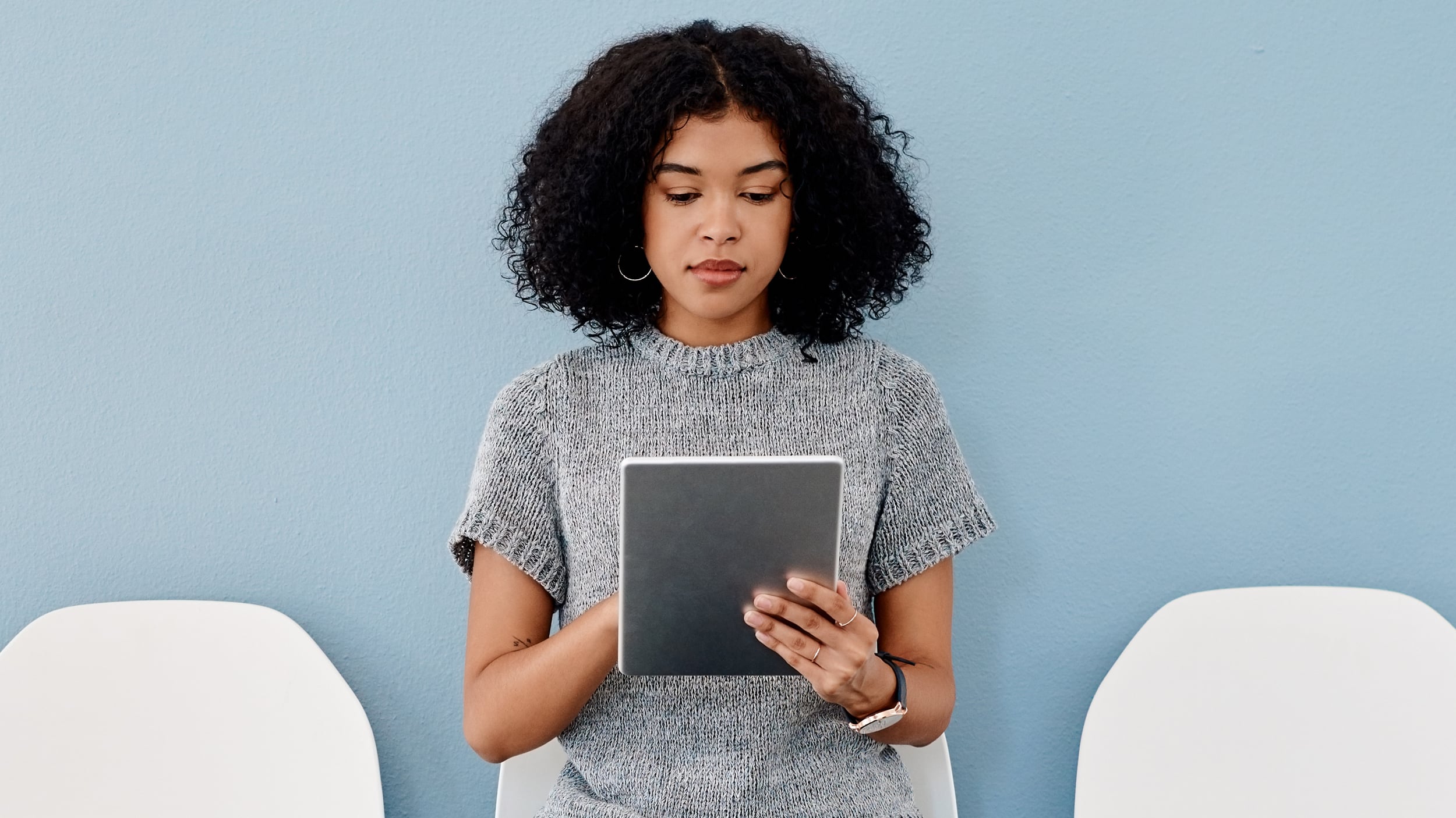 C-Leveled Legacy Blog | Using Social Media for Business | Woman Holding Tablet