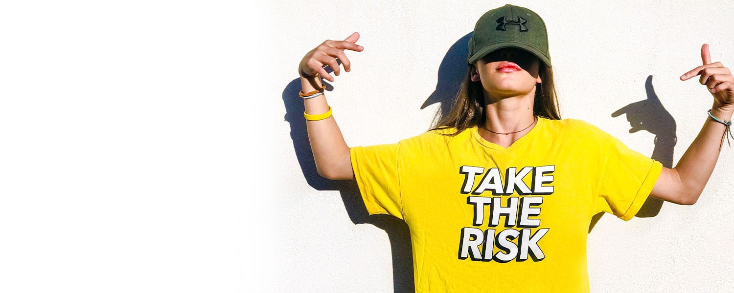Risk Management in Marketing | Woman in Shirt Saying Take the Risk