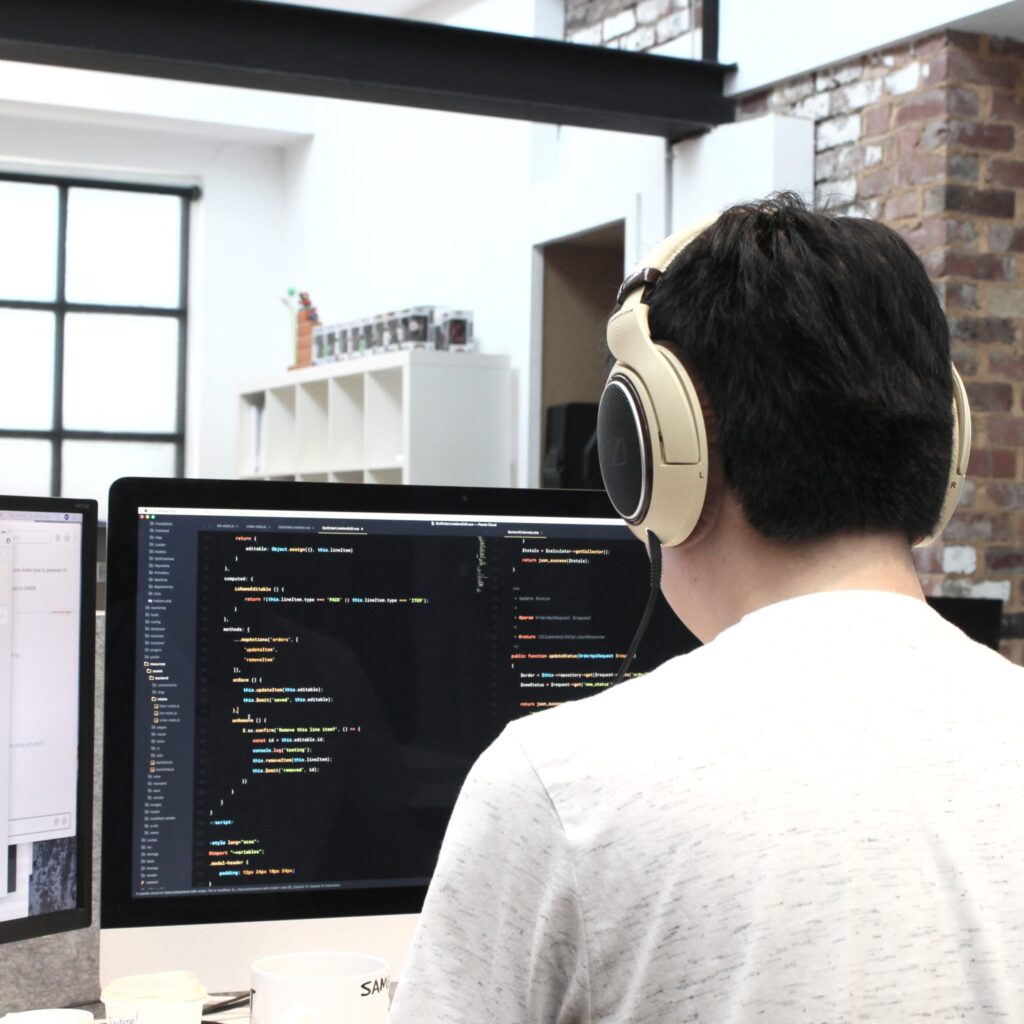 Developer Looking At a Screen of Code Google Tag Manager